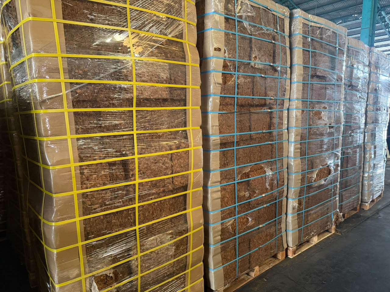 Wrapped and strapped coconut product pallets ready for export
